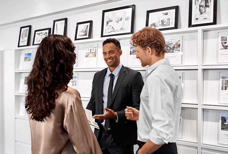 Engel & Völkers advisors with clients in premium office